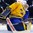 BUFFALO, NEW YORK - JANUARY 4: Sweden's Filip Gustavsson #30 ensures the puck doesn't trickle between his pads into the net during the first period against USA during the semi-final round of the 2018 IIHF World Junior Championship. (Photo by Andrea Cardin/HHOF-IIHF Images)

